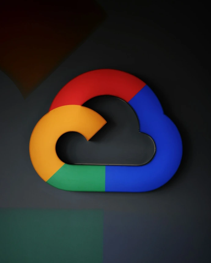 The logo for google is shown on a wall